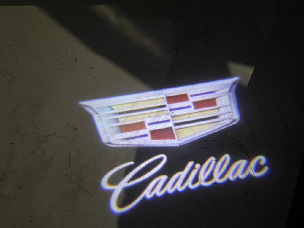 Установка проектора логотипа в двери Cadillac Escalade 5 (GMT T1XX)